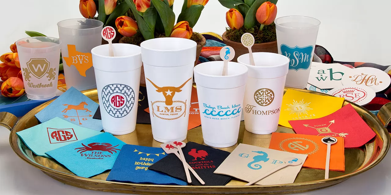 custom cups, personalized napkins, printed stir sticks and coasters with Signature Collection art